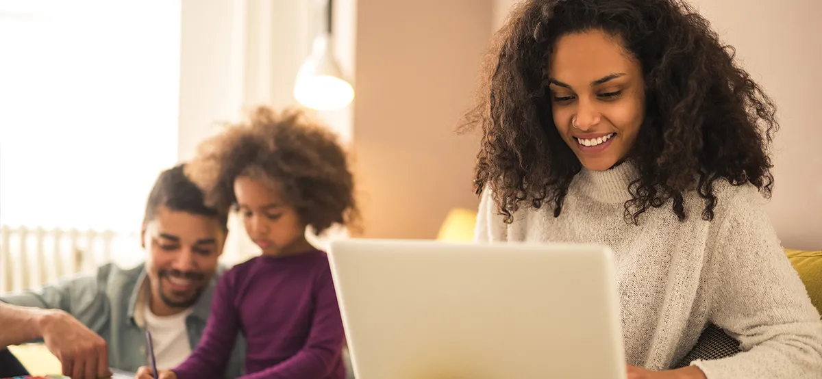 Woman on computer booking hotel